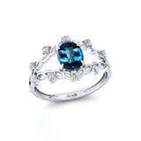 Flower Inspired Ring with Oval Shaped London Blue Topaz and Accent Diamonds - GeumJewels