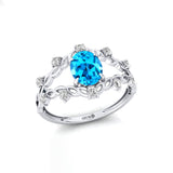 Flower Inspired Ring with Oval Shaped Swiss Blue Topaz and Accent Diamonds - GeumJewels