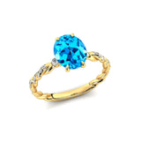 Oval Solitaire Swiss Blue Topaz Ring with Twisted Wire Diamond Band