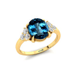 Trio Diamond Engagement Ring with Oval Cut London Blue Topaz