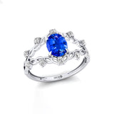 Flower Inspired Ring with Oval Shaped Blue Sapphire and Accent Diamonds