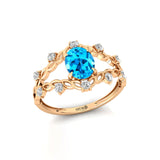 Flower Inspired Ring with Oval Shaped Swiss Blue Topaz and Accent Diamonds