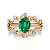 Flower Inspired Ring with Oval Shaped Emerald and Accent Diamonds