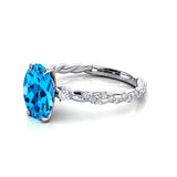 Oval Solitaire Swiss Blue Topaz Ring with Twisted Wire Diamond Band