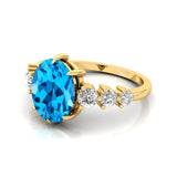 Oval Cut Swiss Blue Topaz with Graduated Diamonds Ring