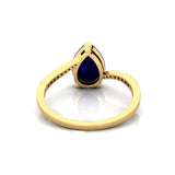 Twisted Up Down Band Pear Shaped Tanzanite Ring with Accent Diamonds