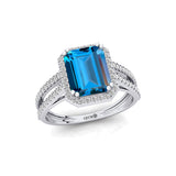 Halo Set Emerald Shaped London Blue Topaz Split Shank Ring with Accent Diamonds