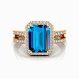 Halo Set Emerald Shaped London Blue Topaz Split Shank Ring with Accent Diamonds