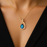 Designer Diamond Loop Pendant with Teardrop Shaped London Blue Topaz