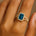 Halo Set Emerald Shaped London Blue Topaz Split Shank Ring with Accent Diamonds - GeumJewels