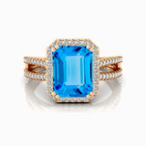 Halo Set Emerald Shaped Swiss Blue Topaz Split Shank Ring with Accent Diamonds