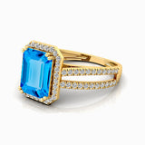 Halo Set Emerald Shaped Swiss Blue Topaz Split Shank Ring with Accent Diamonds