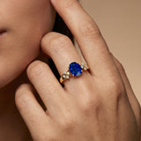Criss Cross Diamond Ring with Oval Cut Blue Sapphire