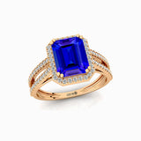 Halo Set Emerald Shaped Tanzanite Split Shank Ring with Accent Diamonds