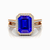 Halo Set Emerald Shaped Tanzanite Split Shank Ring with Accent Diamonds