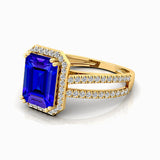 Halo Set Emerald Shaped Tanzanite Split Shank Ring with Accent Diamonds