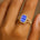 Halo Set Emerald Shaped Tanzanite Split Shank Ring with Accent Diamonds - GeumJewels